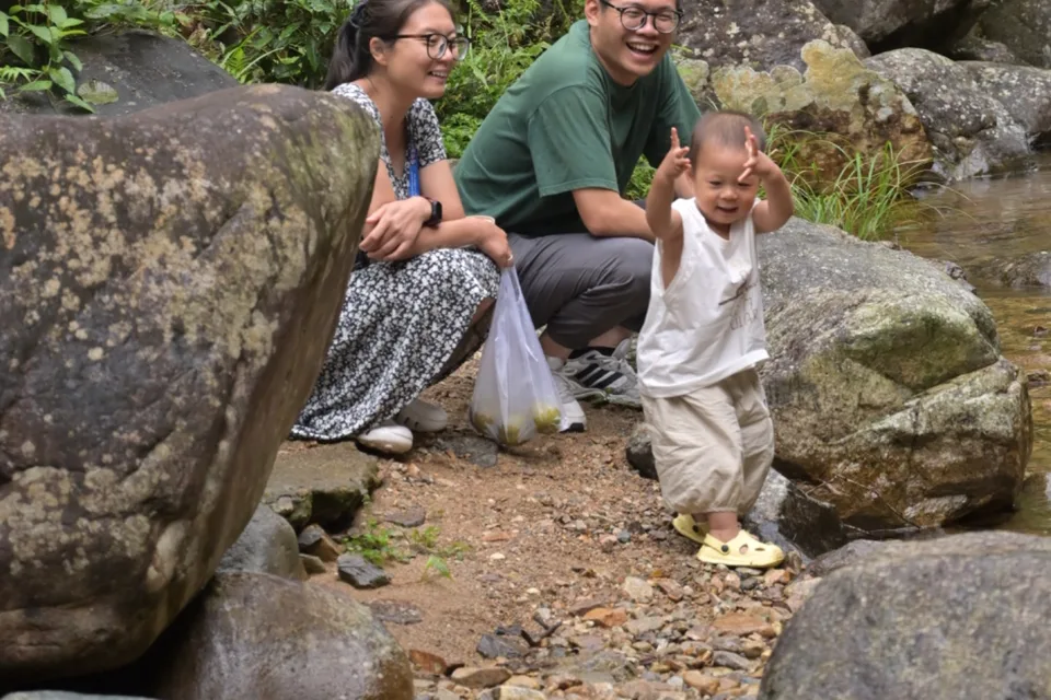 A local family spending time beside a Wuyishan stream